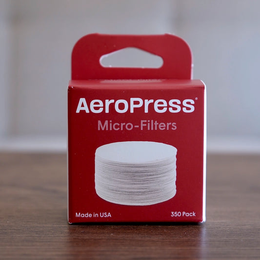 Red box of Aeropress micro-filters white packaging on a light background Basic Barista AeroPress Coffee Filters 350 pack