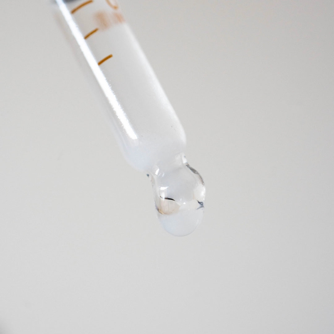 Close-up of a dropper with a clear liquid on a light grey background, Apax Water Brewing Minerals Basic Barista Austarlia Online coffee Brewing Equipment Water For Coffee - Coffee Gear online