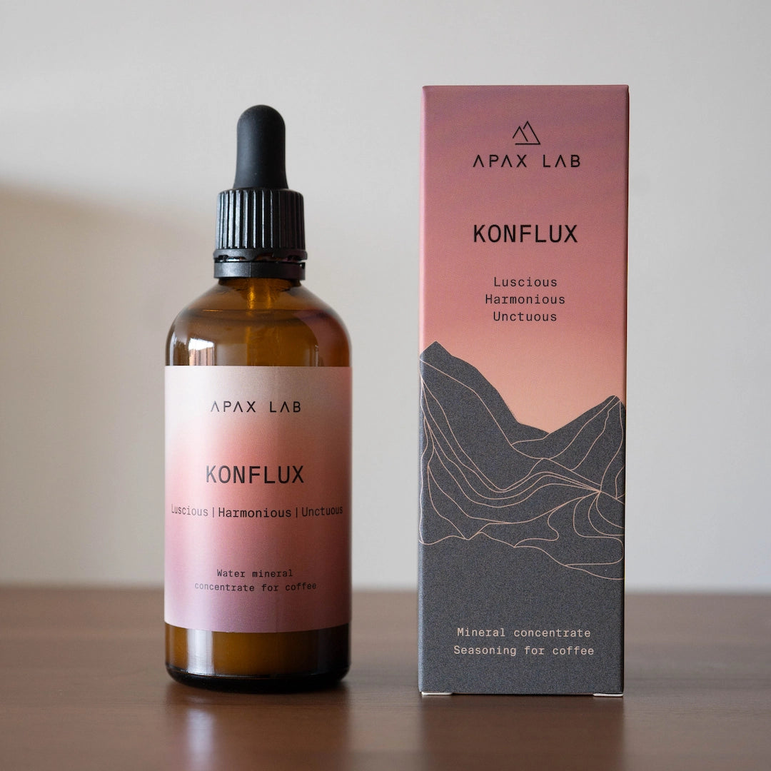 Apax Lab Konflux bottle and packaging on a wooden surface with a neutral kitchen background - Konflux Water Brewing Minerals Basic Barista Australia Coffee Brewing Minerals for pour over coffee