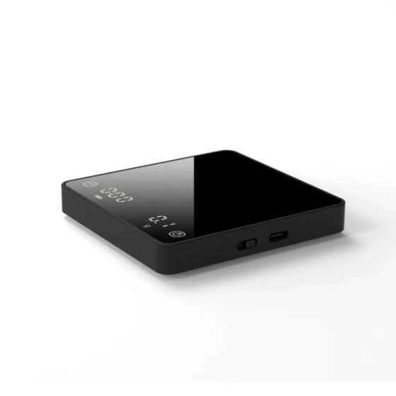 Black electronic espresso scales with digital display on a white background