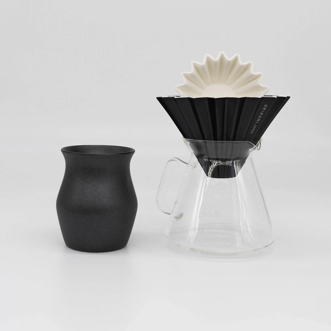 Black ceramic Origami Dripper with white paper coffee filter, clear glass Origami x Hario Server, and black ceramic coffee cup on a white background Basic Barista Coffee Gear Bundle Coffee kit Large size M