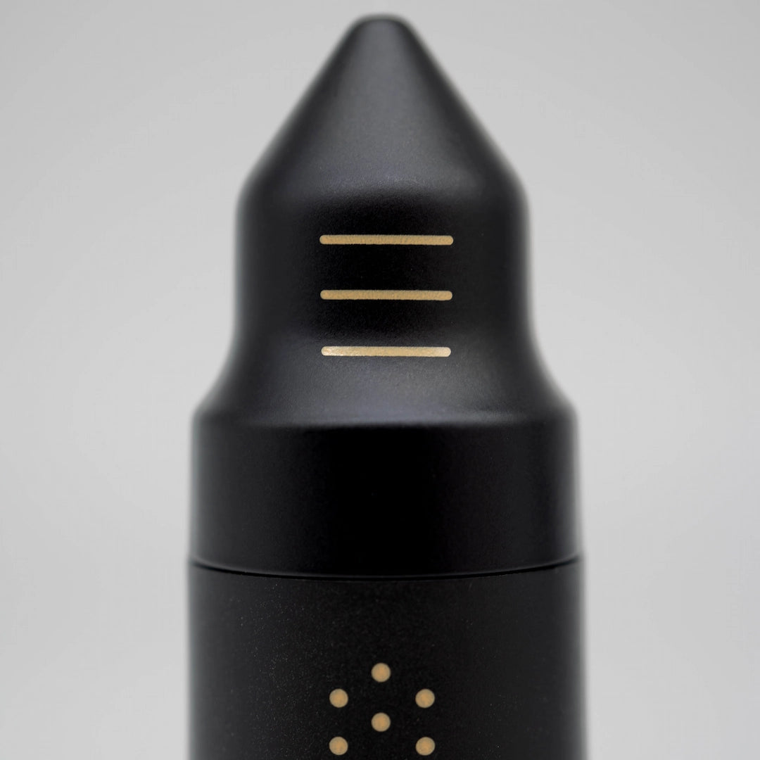 Black Nucleus Bloom WDT Tool Flow Tip with gold accents on a grey background Basic Barista Coffee Brewing Gear Online Melbourne Australia