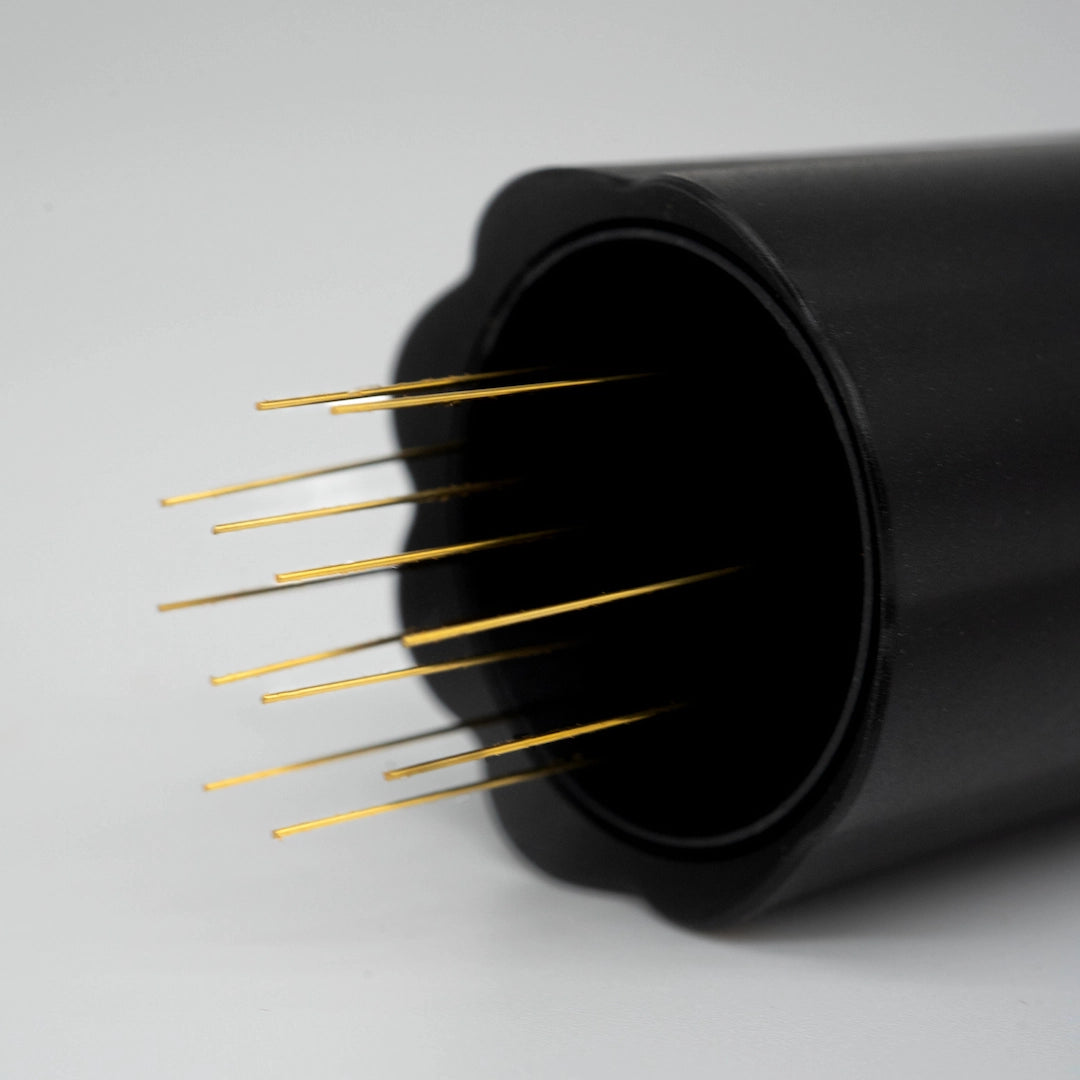 Black container gold needles on a grey background - Nucleus Bloom WDT Needle Tool Basic Barista Coffee Gear