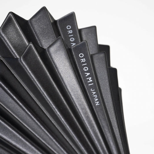 Matte Black Origami Dripper Limited edition coffee brewer Basic Barista Coffee Brewer cone on white background close up of 'ORIGAMI Japan' logo