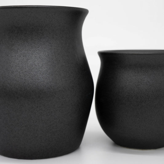 Two Origami Coffee Cup Matte Black Specialty Coffee Cups close up textured ceramic Basic Barista Brew Gear on white background