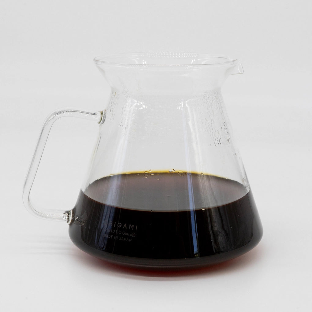 Origami Glass coffee Server filled half way with brewed pour over coffee on a white background Basic Barista image
