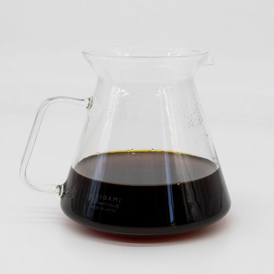 Origami Glass coffee Server filled half way with brewed pour over coffee on a white background Basic Barista image
