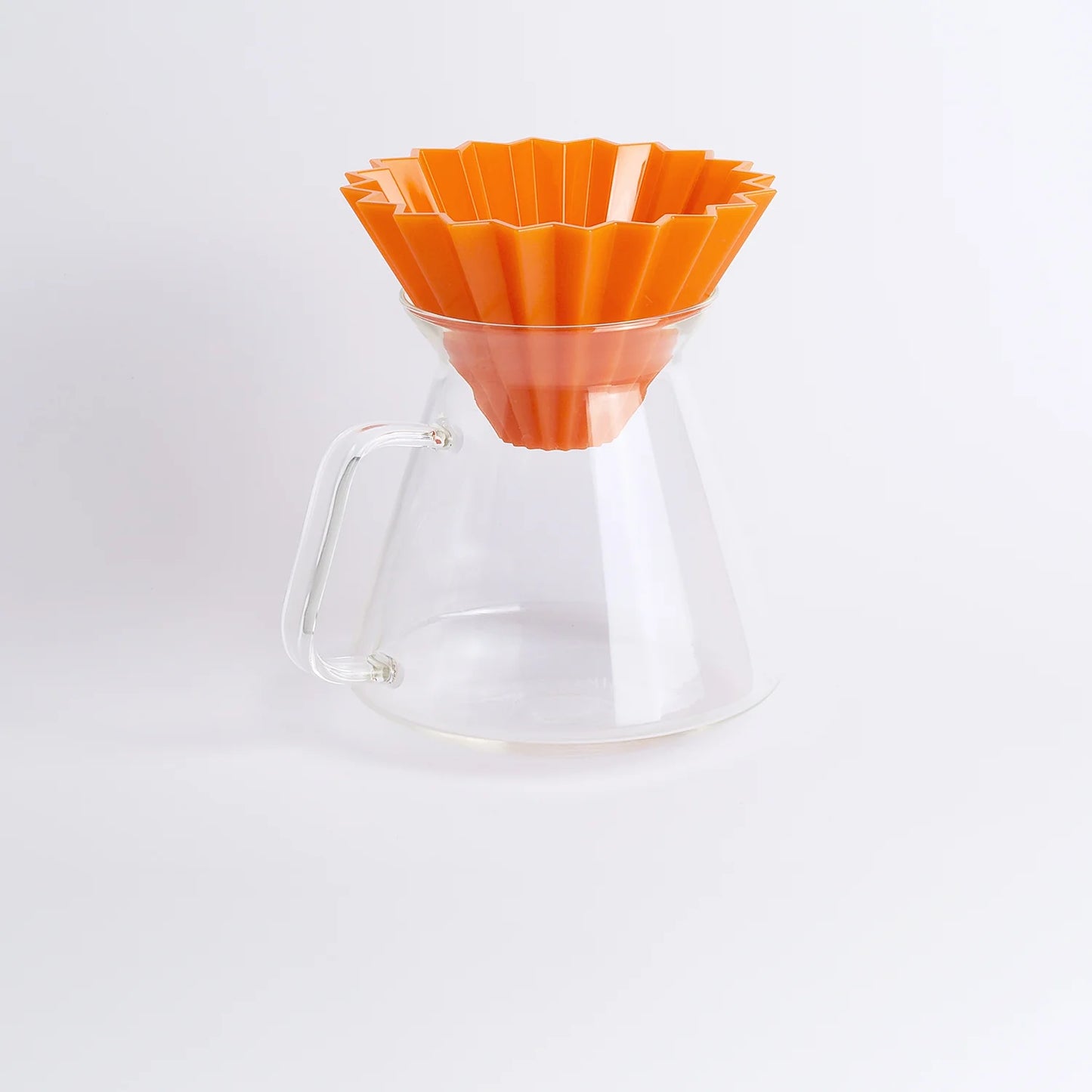A clear glass coffee server with an orange origami dripper on top, featuring a glass handle Origami x Hario Collaborative Glass Coffee Server Basic Barista Australia Coffee Gear