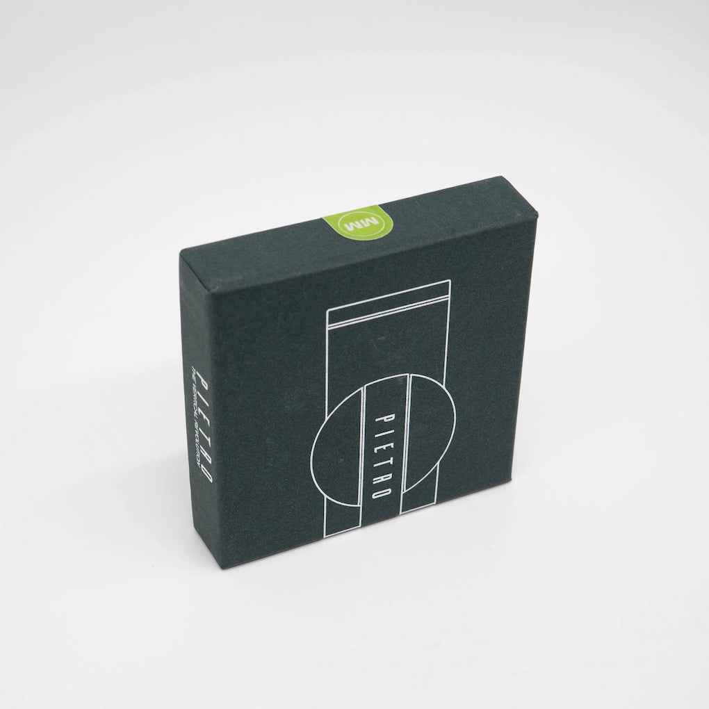 Pietro M Modal Replacement Coffee Burrs in dark green packaging box on white background Basic Barista Coffee Gear