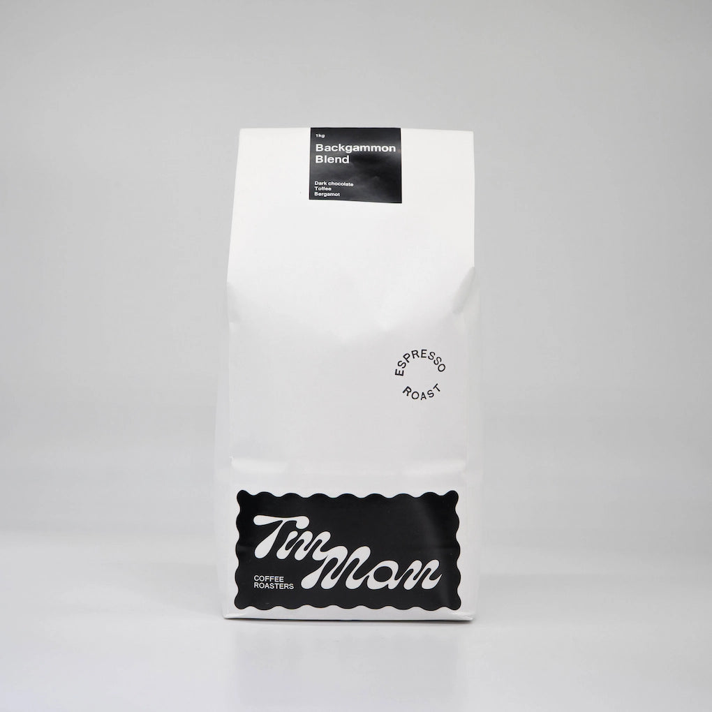 Coffee package labeled 'Backgammon Blend' by Tin Man Coffee Roasters on a gray background Backgammon Blend Roasted Coffee Beans Basic Barista 1kg bag paper coffee bag
