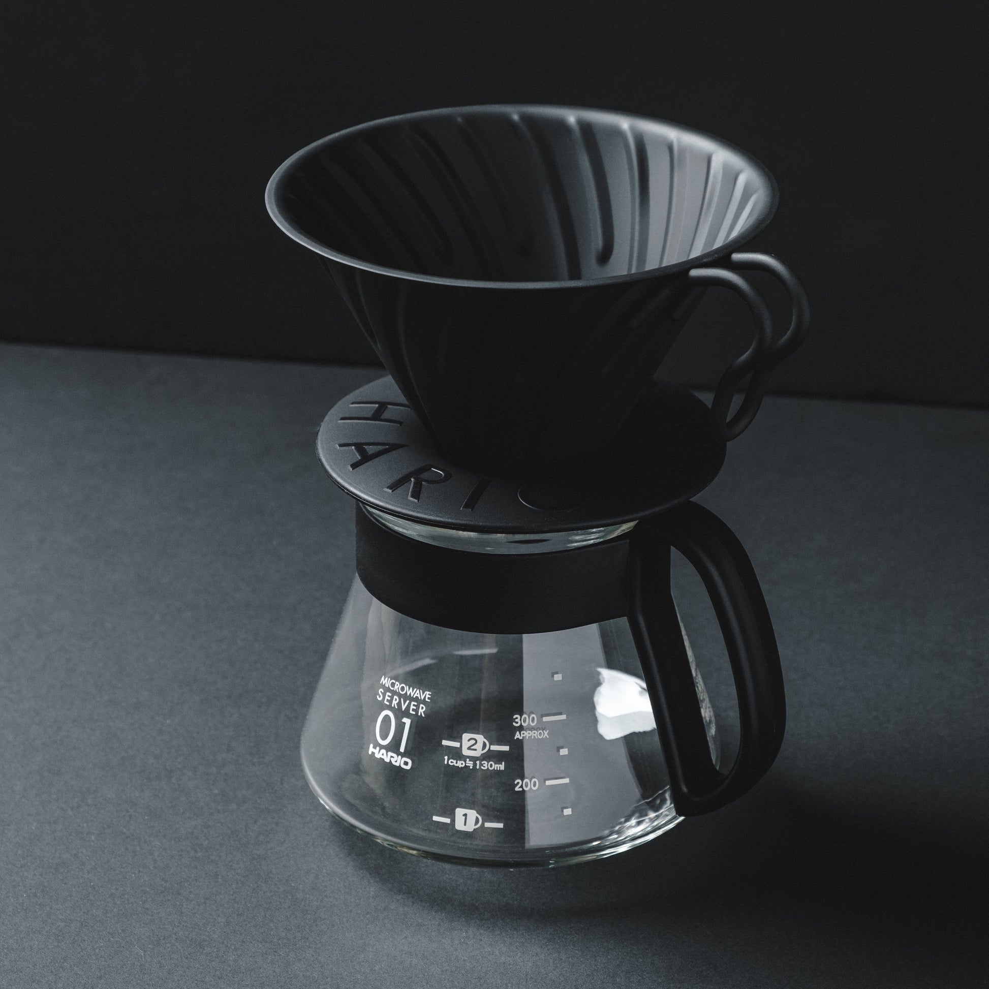 Hario V60 Metal Matte Black Coffee Dripper on Hario server