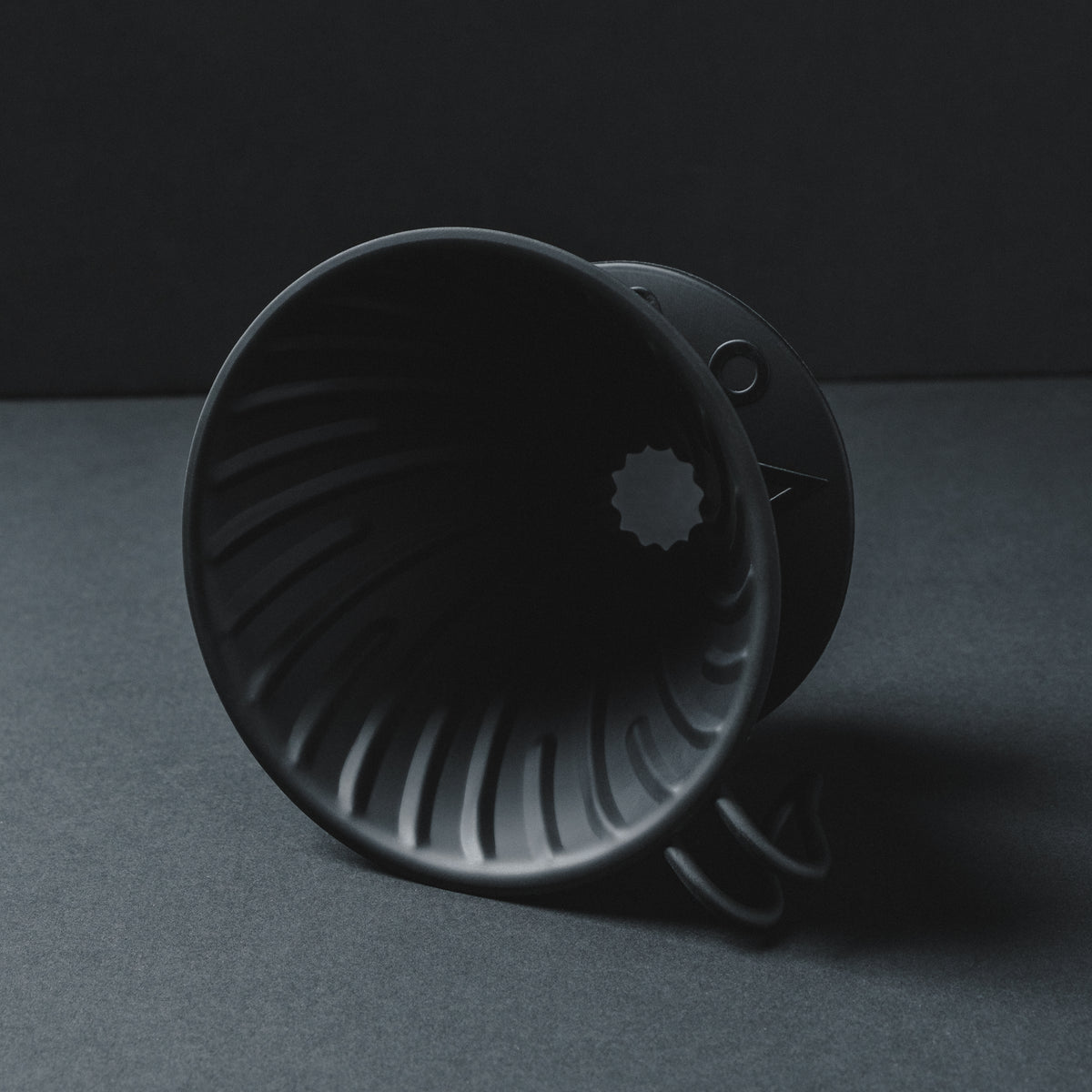 Hario V60 Metal Matte Black Coffee Dripper on side - Close up shadowy shot with cinematic pour over aesthetic Basic Barista Photography