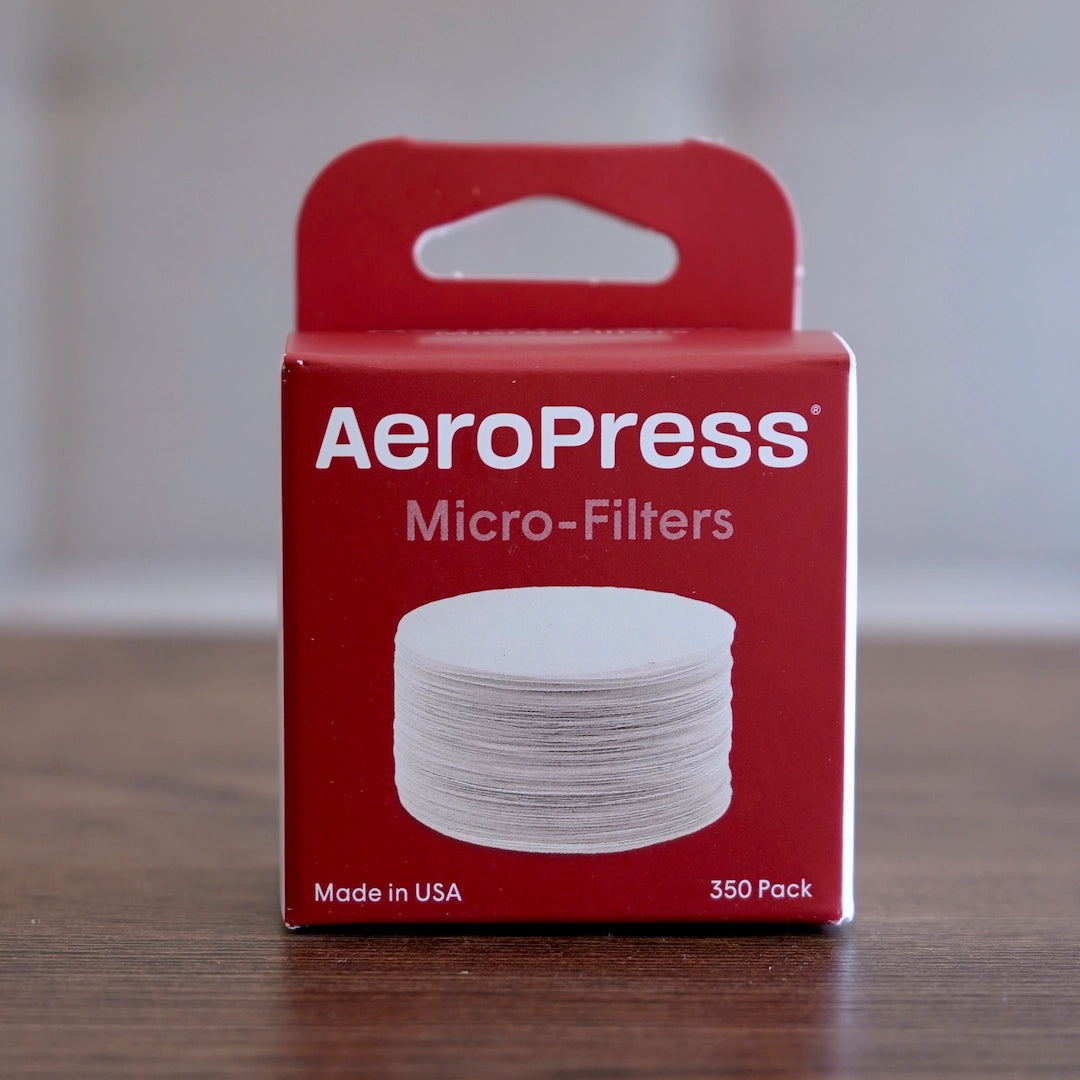 Red box of Aeropress micro-filters white packaging on a light background Basic Barista AeroPress Coffee Filters 350 pack