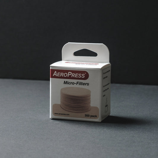 Aeropress micro filters white packaging on a dark background Basic Barista AeroPress Coffee Filters