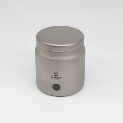 Silver titanium metal container with coffee beans on a white background Basic Barista Coffee Gear Logo Etched Coffee Bean Storage container 