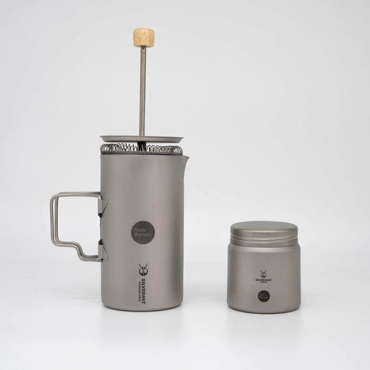 Grey Titanium coffee press with wooden handle and Basic Barista Coffee Bean Storage Container on a white background  Basic Barista Coffee Gear