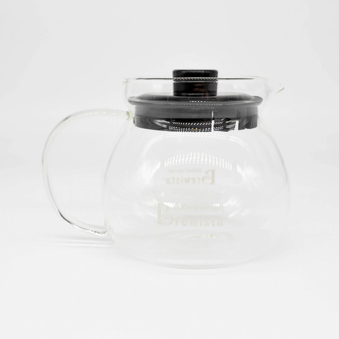 A 600ml glass coffee server carafe by Brewista, featuring a clear glass body, a black lid, and a clear glass handle, shown on a white background.