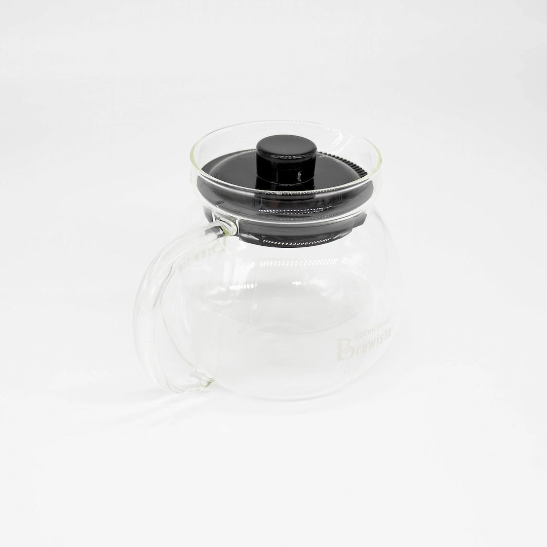 A 600ml glass coffee server carafe by Brewista, featuring a clear glass body, a black lid, and a clear glass handle, shown on a white background.