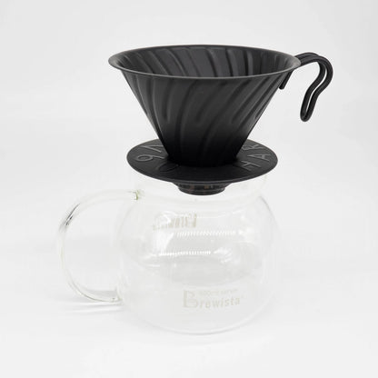 A 600ml glass coffee server carafe by Brewista, featuring a clear glass body, a black lid, and a clear glass handle, shown on a white background.