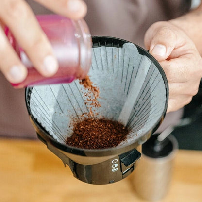 Bruer Spectrum U shaped filters in a Moccamaster Batch Brew Coffee Basket - Pour Coffee Grounds from pink cup close up Basic Barista Coffee Gear Online