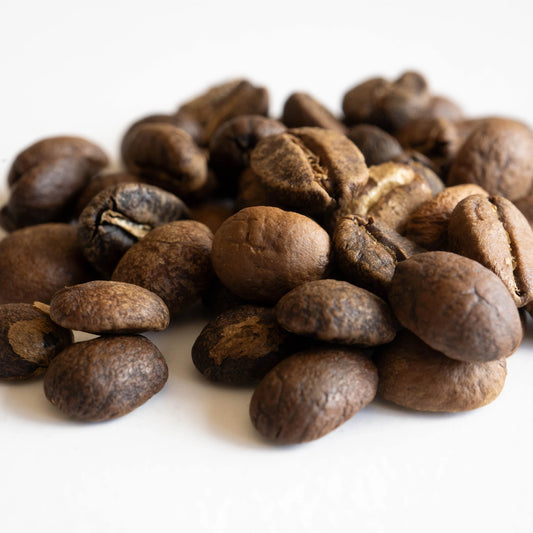 Pile of coffee beans on a white background Candy Blast Colombian Specialty Coffee Beans Basic Barista Pour Over Coffee Gear Brew Gear Freshly Roasted Coffee Beans