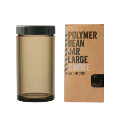 Brown Comandante Smoke polymer bean jar with black lid and matching cardboard box on a white background