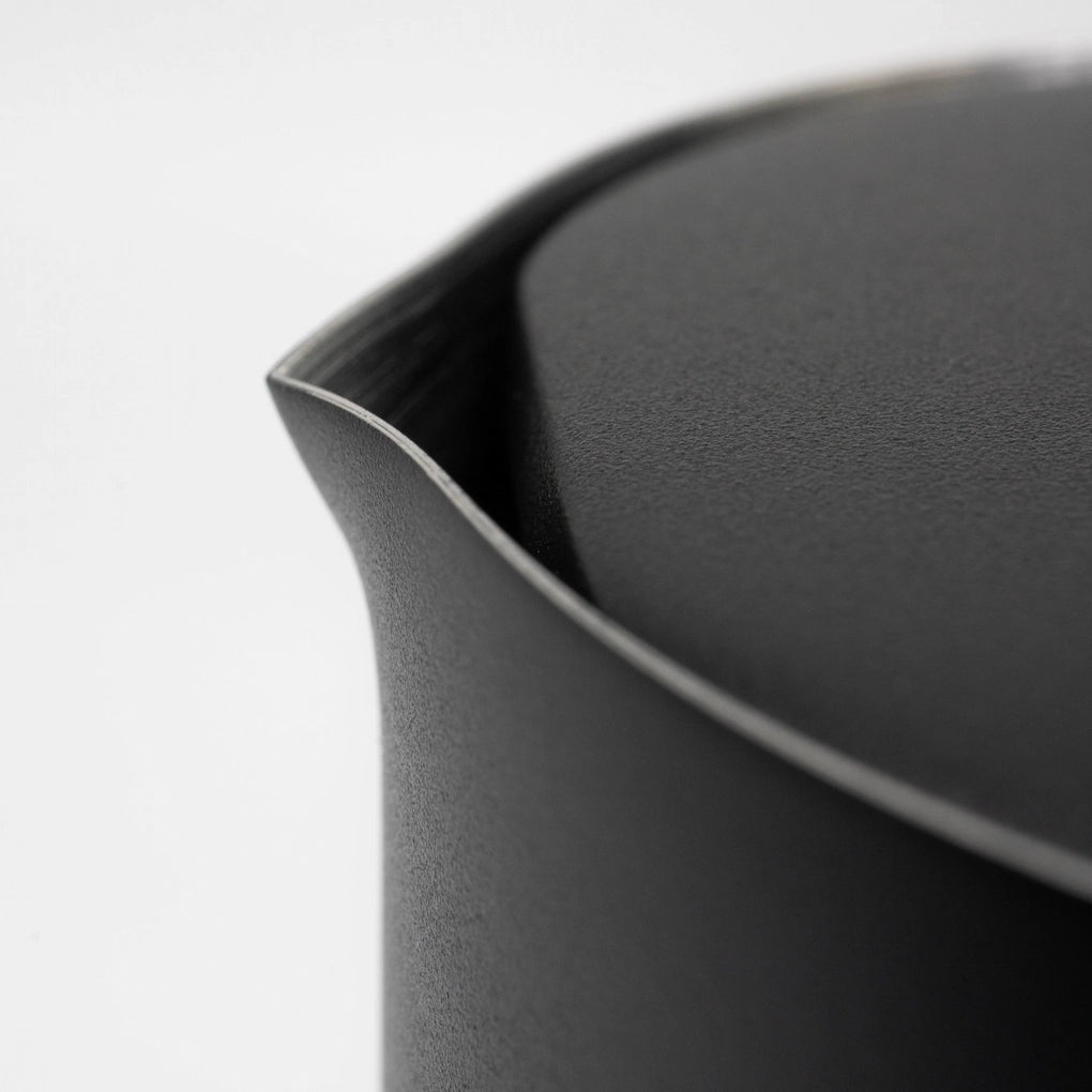 Close up of a black stainless steel matte black coated french press spout and lid on a light grey background Basic Barista Matte Black Design Coffee Gear Online 