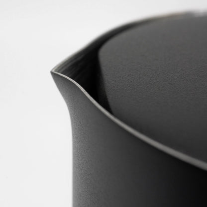 Close up of a black stainless steel matte black coated french press spout and lid on a light grey background Basic Barista Matte Black Design Coffee Gear Online 