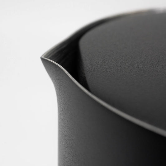 Close up of a black stainless steel matte black coated french press spout and lid on a light grey background Basic Barista Matte Black Design Coffee Gear Online 