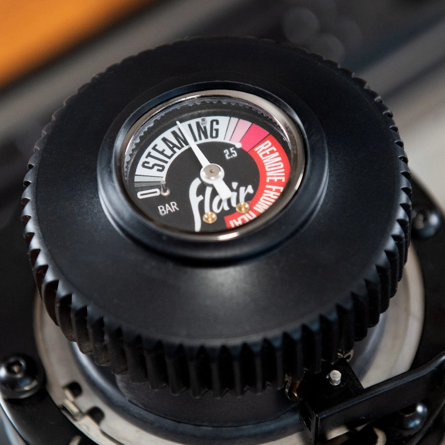 Flair Wizard Steamer stovetop Milk foamer Basic Barista close up of pressure gauge on stove top with kitchen as background