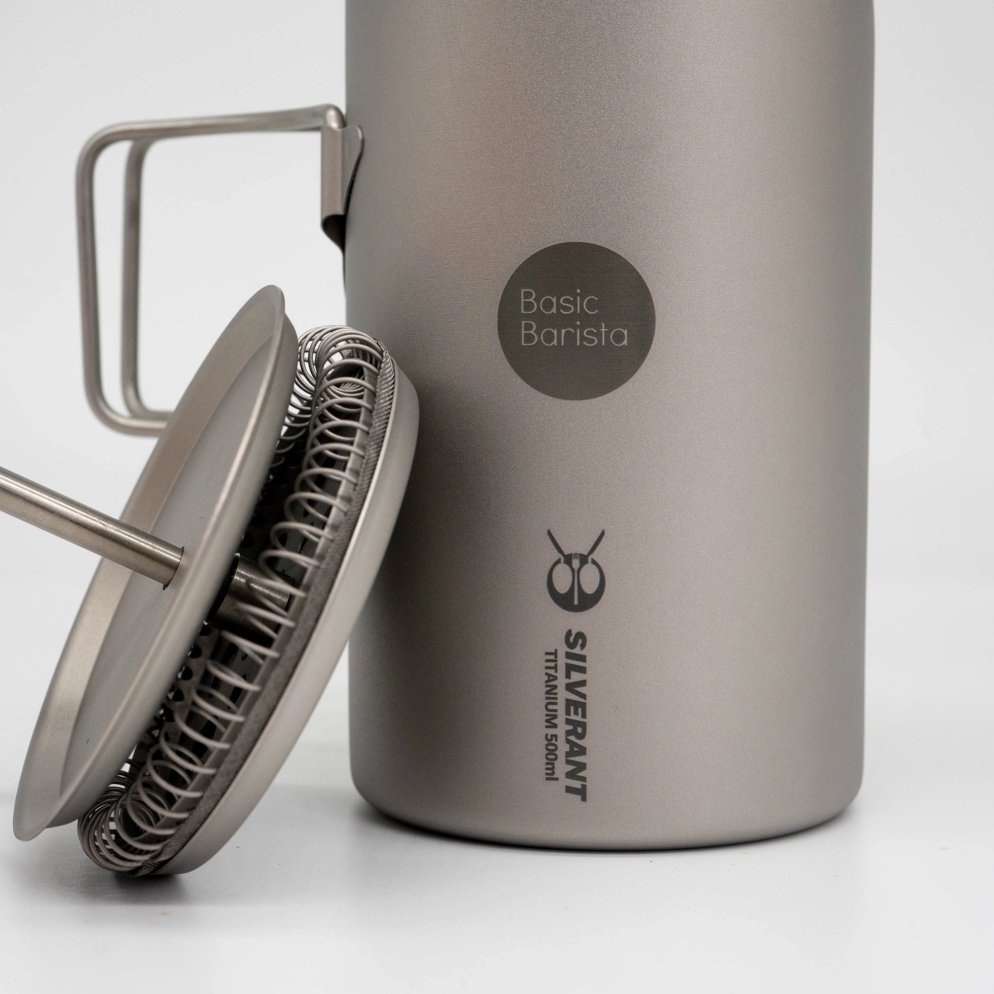 Titanium coffee press with 'Basic Barista' and 'Silverant' branding on a white background French Press coffee gear