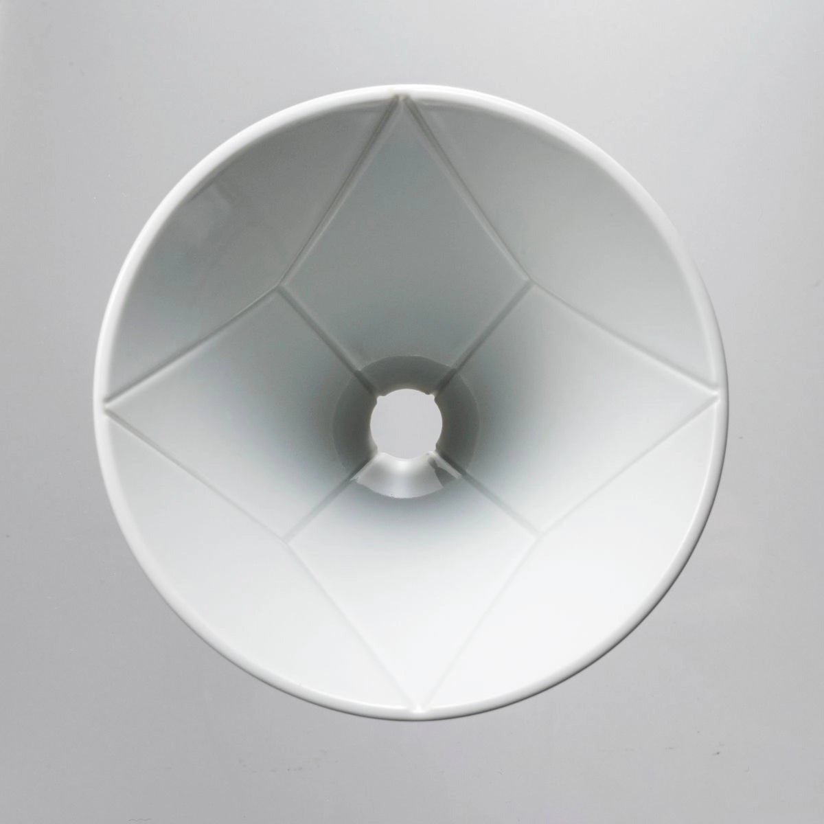 White ceramic coffee filter on a grey background Hario V60 Mugen Dripper Single Pour Coffee Brewer Basic Barista