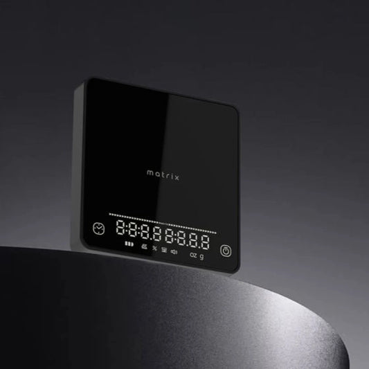 Black digital display with 'matrix' branding on a dark background Basic Barista Coffee Gear