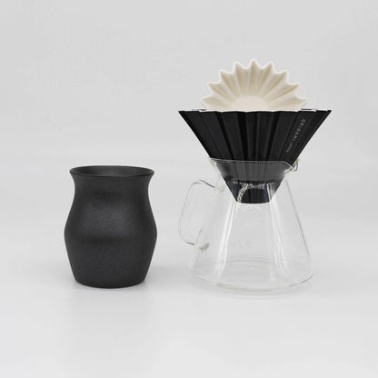 Black ceramic Origami Dripper with white paper coffee filter, clear glass Origami x Hario Server, and black ceramic coffee cup on a white background Basic Barista Coffee Gear Bundle Coffee kit Large size M