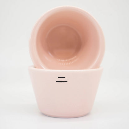Two Pink Ni Wares Espresso Toto cups stacked on top of each other with two '-' dash lines symbolising the thick sided lip on a white background Basic Barista Cafe Equipment Espresso Coffee Cups