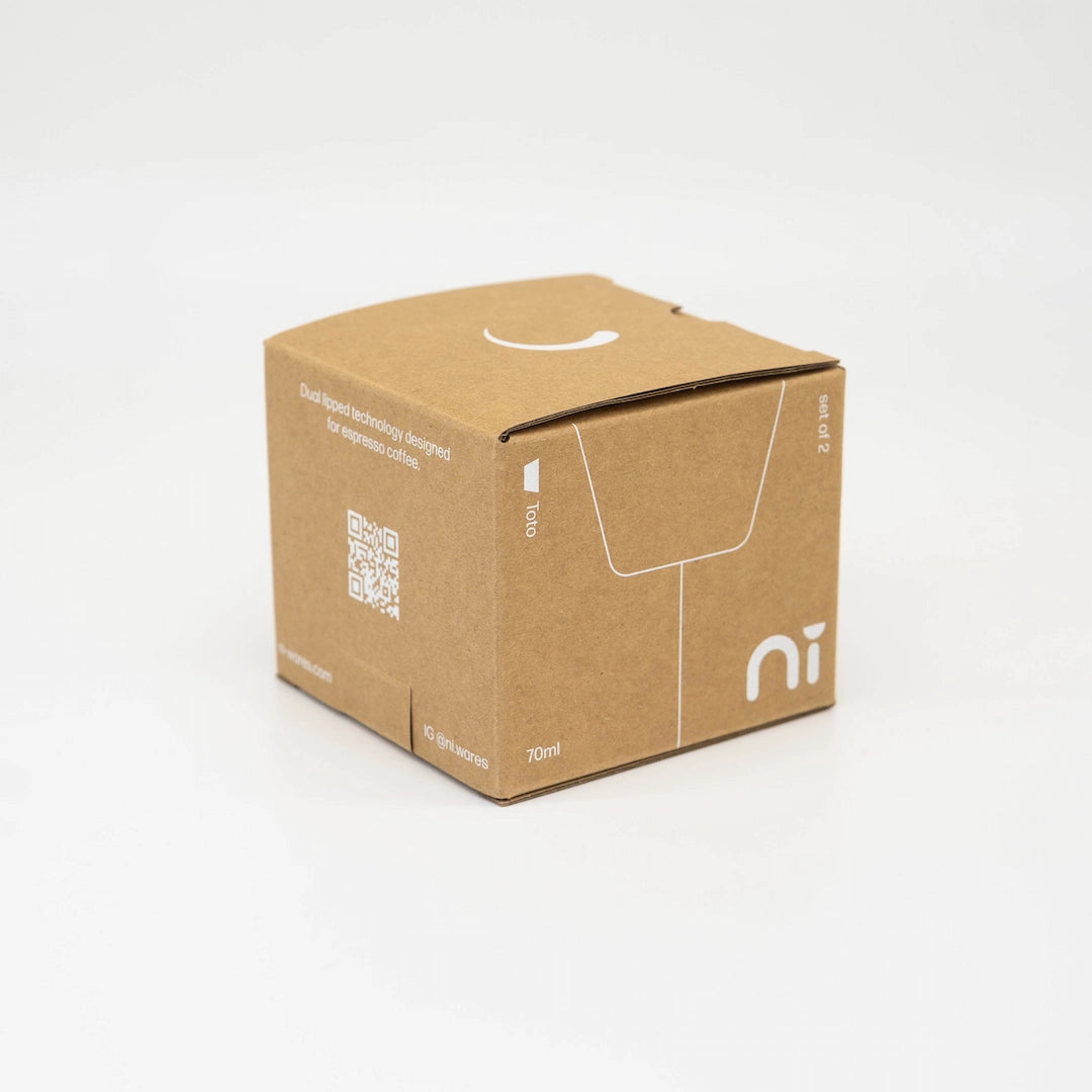 Brown cardboard box with a QR code and logo on a white background, Packaging for Ni Wares toto Espresso Cups Set of 2 2pk espresso cups Basic Barista