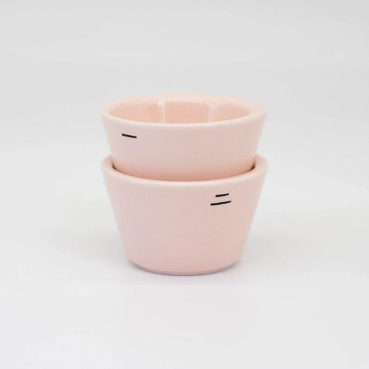 Two pink ceramic espresso cups stacked on a white background - Ni ares Toto Espresso Cups Pink coffee cups for World Barista Champion Jack Simpson Hanny Ezzat Basic Barista Coffee Gear Online
