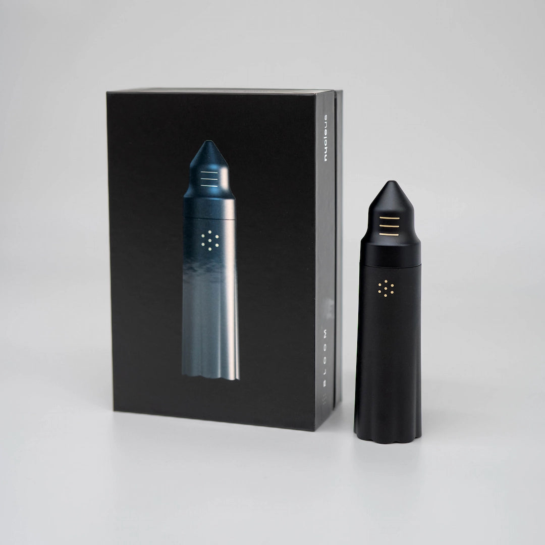 Nucleus Bloom WDT Tool Black cylinder on grey background with packaging Basic Barista Coffee Gear
 