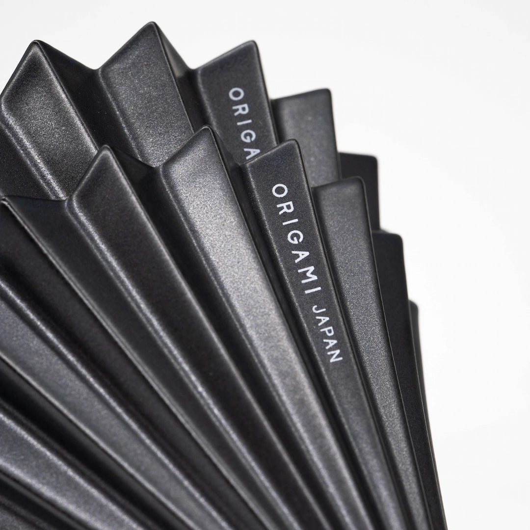 Matte Black Origami Dripper Limited edition coffee brewer Basic Barista Coffee Brewer cone on white background close up of 'ORIGAMI Japan' logo