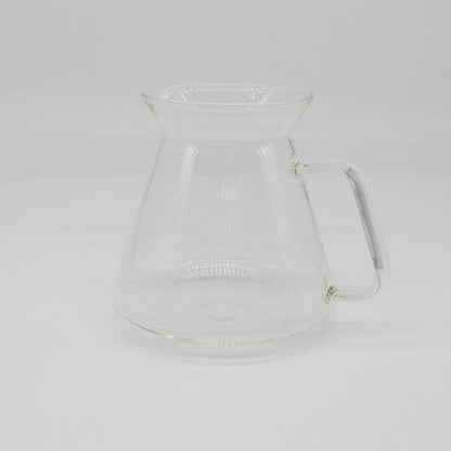 Clear glass HARIO x Origami Dripper coffee carafe on a white background