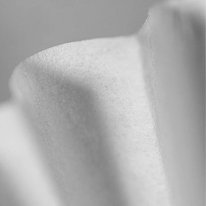 Close-up of textured white paper used in Sibarist Wave Style Filter Papers with folds mountain waves Basic Barista