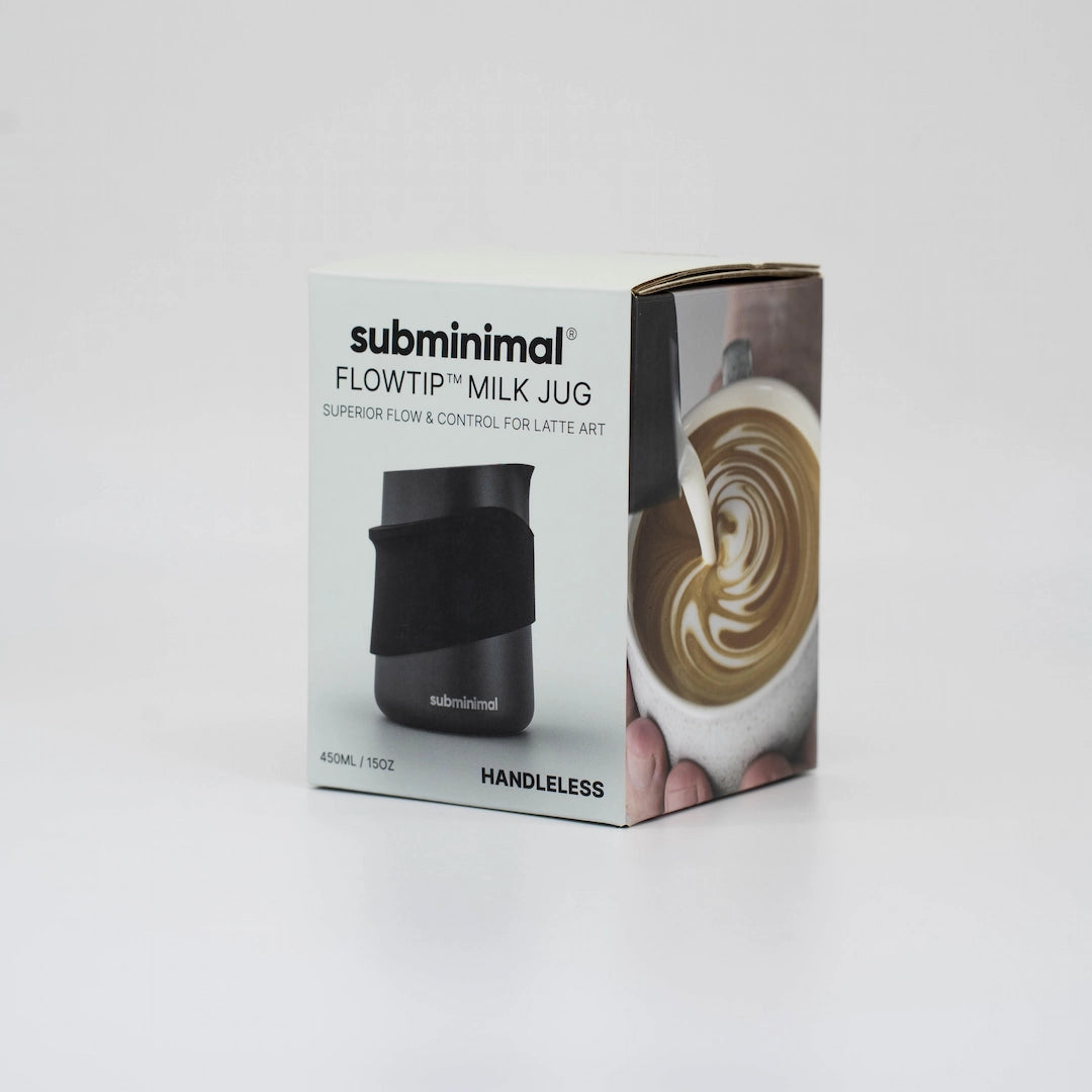 Box of subminimal Flowtip Milk Jug with a black milk jug and latte art on a white background. _ Basic Barista Coffee Gear and cafe equipment Online Basic Barista Brew Gear