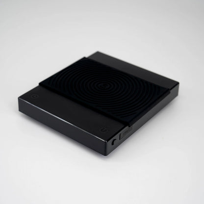 Timemore Black Mirror Basic 2 Coffee Brewing Scale, black colour, displaying digital screen with weight measurements. Basic Barista Coffee Brewing Scale Budget Coffee Gear Scale Brewers