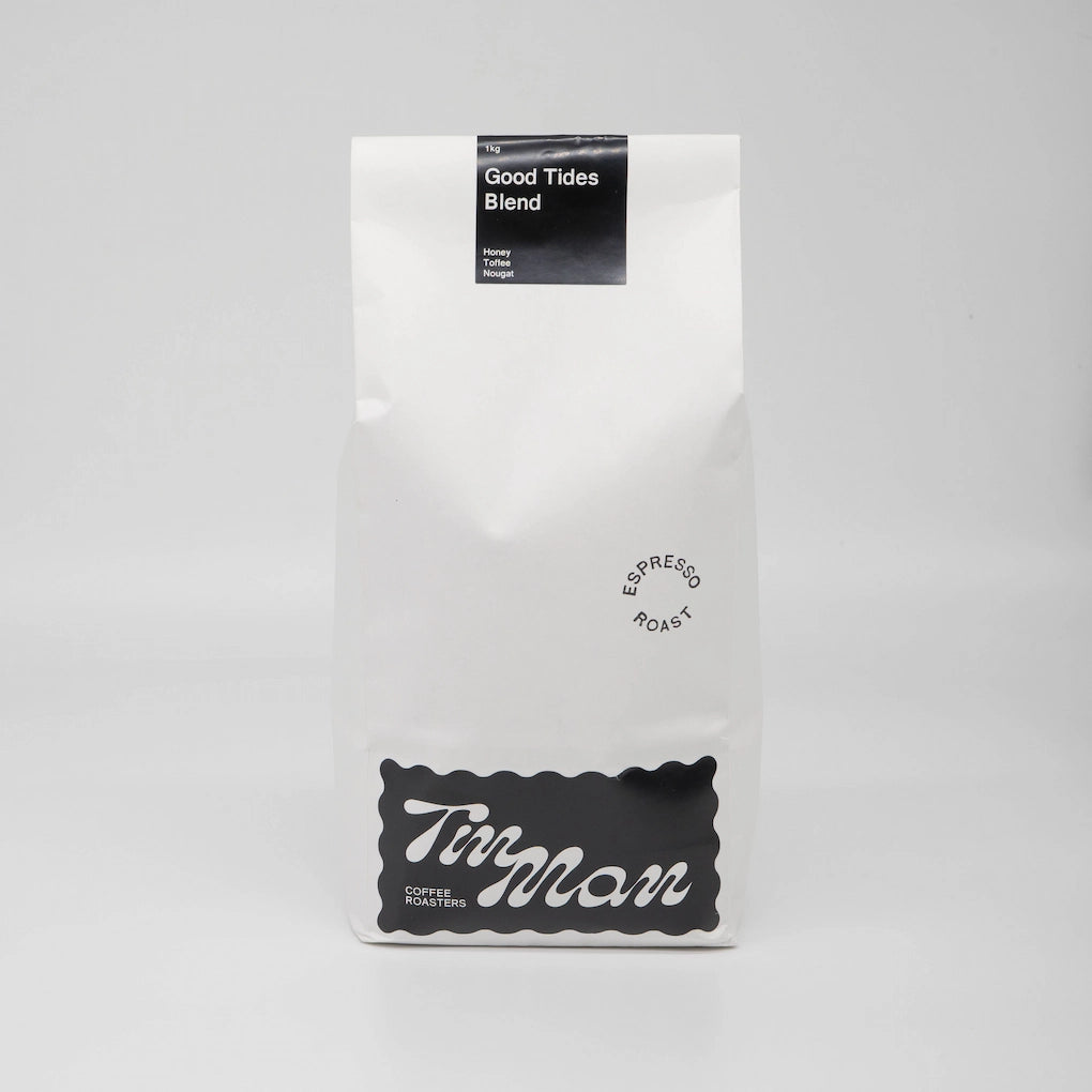 Coffee package labeled 'Good Tides Blend' by 'Tin Man' on a grey background Roasted Coffee Beans Basic Barista 1kg