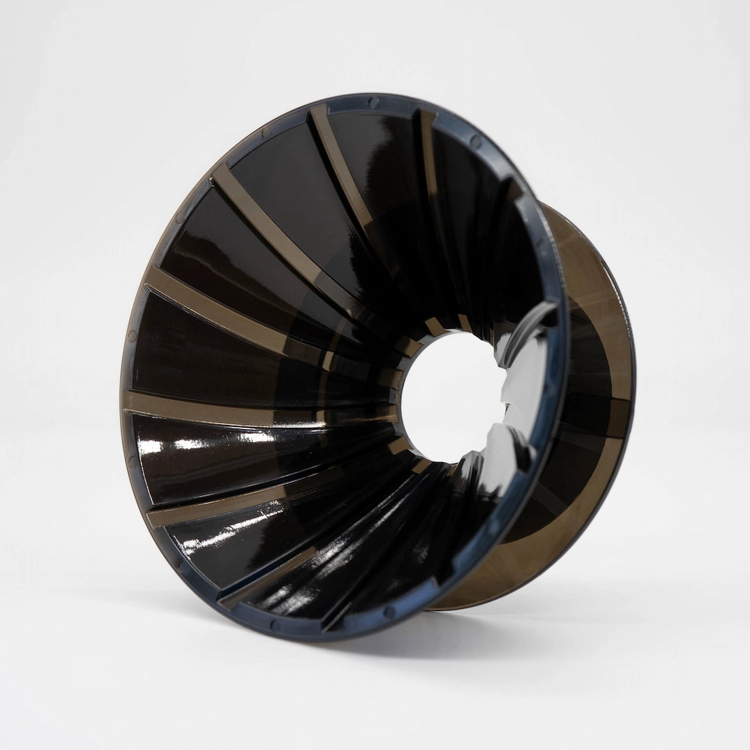 Black plastic UFO Dripper on a white background Basic Barista Pour Over Coffee Gear