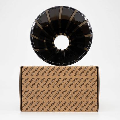 Black plastic UFO Dripper sitting on top of retail box on a white background Basic Barista Pour Over Coffee Gear