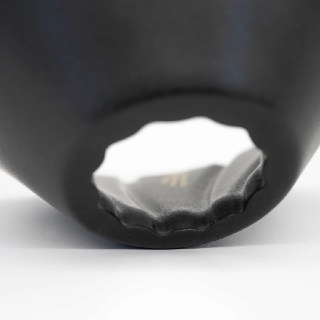 Black and white UFO Dripper Ceramic Matte Black on a White background Close up of dripper hole 80º