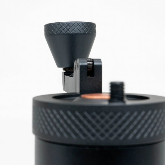 Close up of black travel coffee grinder handle and crank on a white background | VSSL Java Grinder Basic Barista Portable coffee Grinders