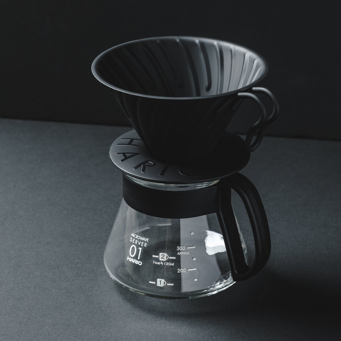 HARIO V60 Metal Matte Black Pour Over Coffee Dripper on Glass HARIO server - Basic Barista Coffee Content Photography Brew Gear Coffee Drippers Online Brew Gear